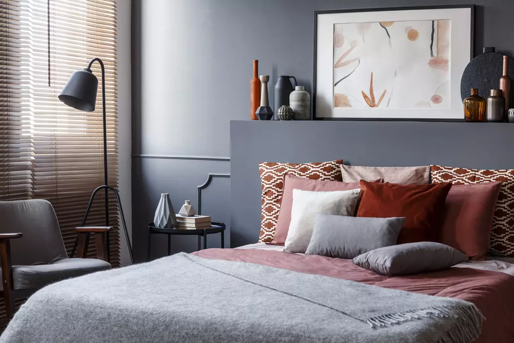 Room-Details-creative-poster-on-black-bedhead-above-cozy-bed-wi-2024-10-18-08-45-58-utc.webp